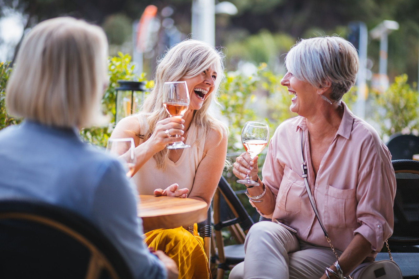 55-plus women toasting with wine glasses