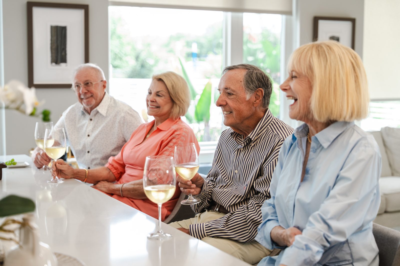 Couples enjoying drinks in a spacious apartment at The Bailey at Bridge Park